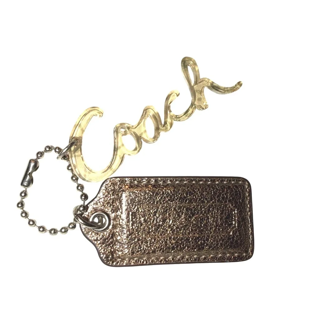 Coach Metallic Bronze Leather Hangtag and Clear Acrylic Script Logo Bag Charm